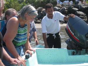 Wadeing out to the boat to climb in