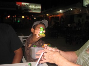 Little boy trying to sell his wares to Sylvia