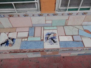 Mosaic bench in front of shop