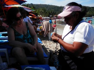 Juanita changing the length on my necklace while Sylvia looks on