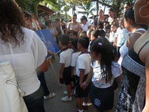 Kids in cute uniforms during a busy garage sale